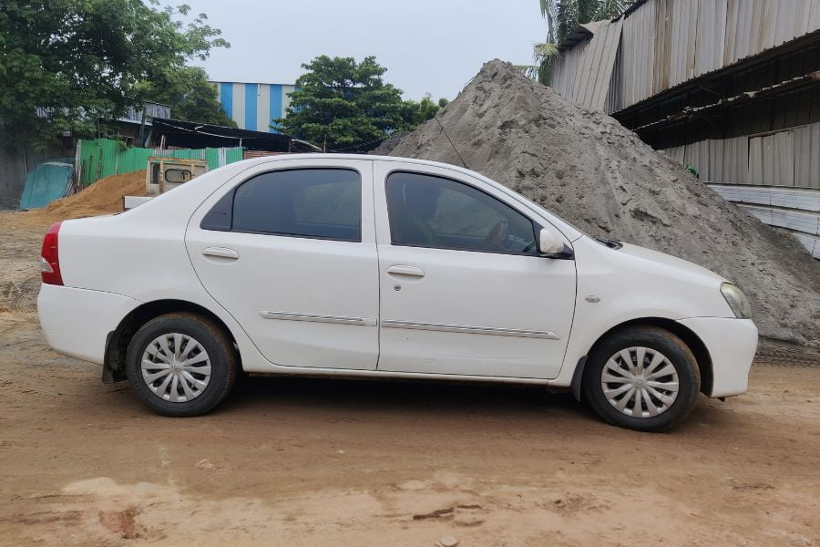 Toyota Etios car rental in Chennai - white sedan side view