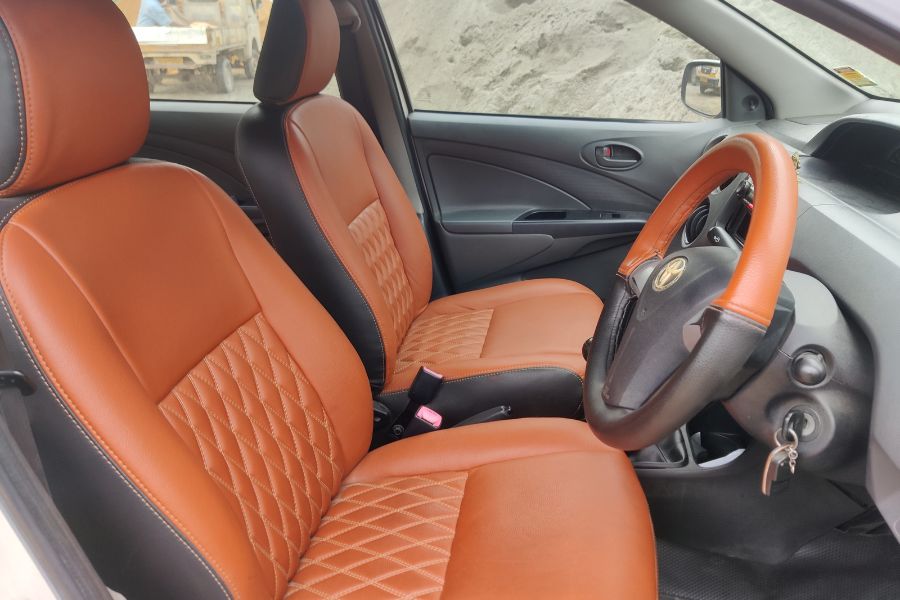 Toyota Etios interior in Chennai rental car - front seats and steering wheel