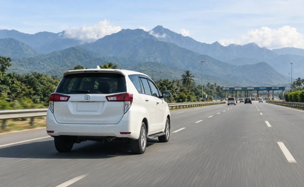 Rental car on a scenic Coorg road near coffee plantations